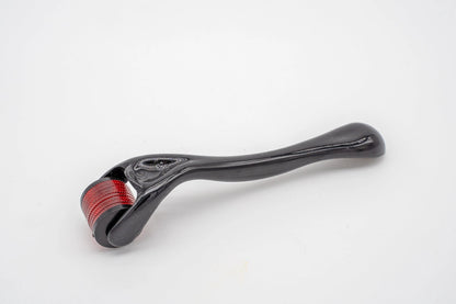 A black plastic micro-needle dermal roller with a red roller, on a white background