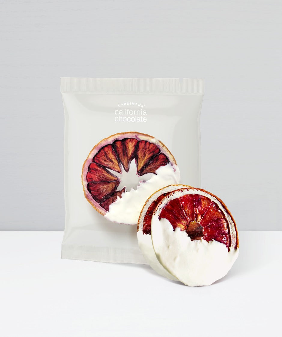 2 dehydrated blood orange slices dipped in a white chocolate on one half